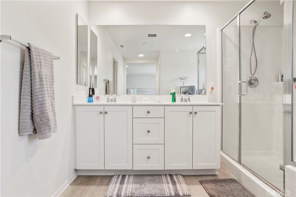 Bathroom, Dual Sink Vanities, Glass Shower, Interior, Recessed Lighting, Wood Texture Flooring
