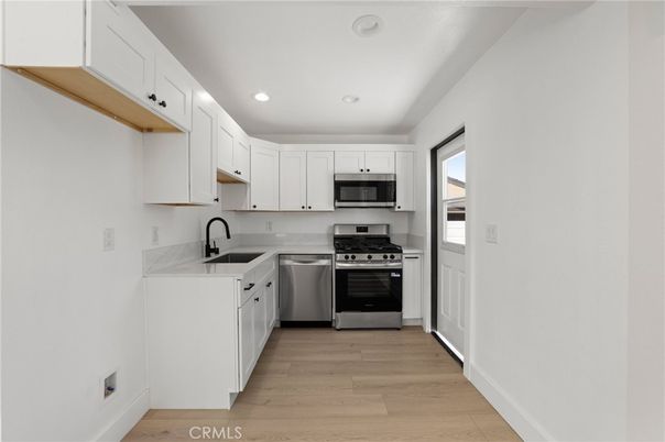 Interior, Kitchen, Recessed Lighting, Stainless Steel Appliances, Wood Texture Flooring