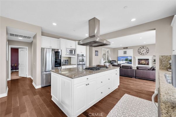 Fireplace, Interior, Kitchen, Living room, Recessed Lighting, Stainless Steel Appliances, Wood Texture Flooring