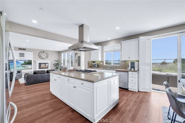 Fireplace, Interior, Kitchen, Living room, Recessed Lighting, Stainless Steel Appliances, Wood Texture Flooring