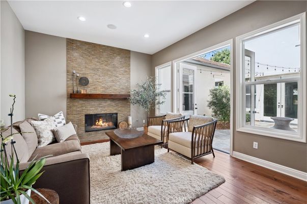 Fireplace, Interior, Living room, Recessed Lighting, Stone Walls, Wood Texture Flooring