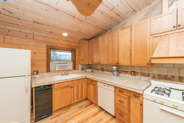 Interior, Kitchen, Tile Countertops, Wooden Ceilings, Wood Texture Flooring, Wooden Walls