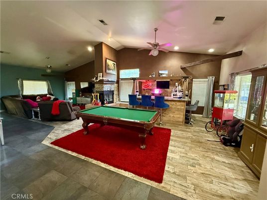 Billiard Table, Fireplace, Game Room, Interior, Living room, Recessed Lighting, Stone Walls, Wood Texture Flooring
