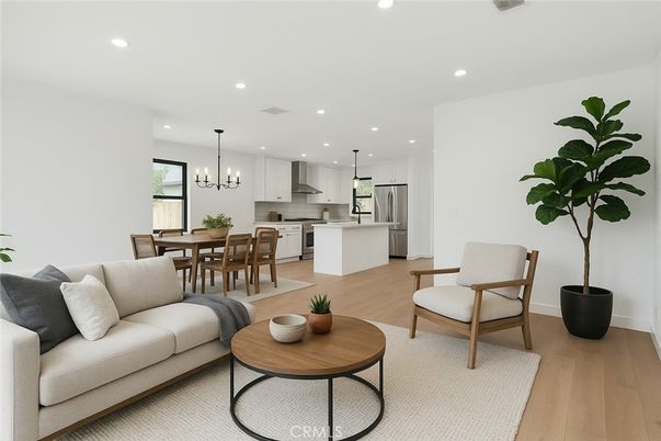 Chandelier, Dining room, Interior, Kitchen, Living room, Pendant Lights, Recessed Lighting, Stainless Steel Appliances, Wood Texture Flooring