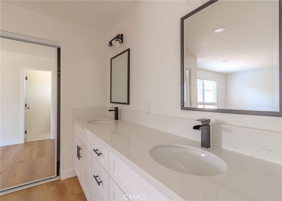 Bathroom, Dual Sink Vanities, Interior, Recessed Lighting, Wood Texture Flooring