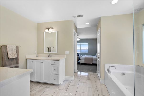 Bathroom, Bedroom, Dual Sink Vanities, Interior, Recessed Lighting, Water, Wood Texture Flooring
