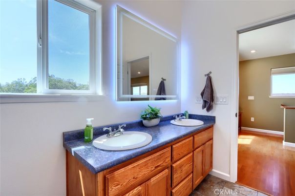 Bathroom, Dual Sink Vanities, Interior, Recessed Lighting, Wood Texture Flooring