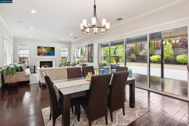Chandelier, Dining room, Fireplace, Interior, Living room, Recessed Lighting, Wood Texture Flooring