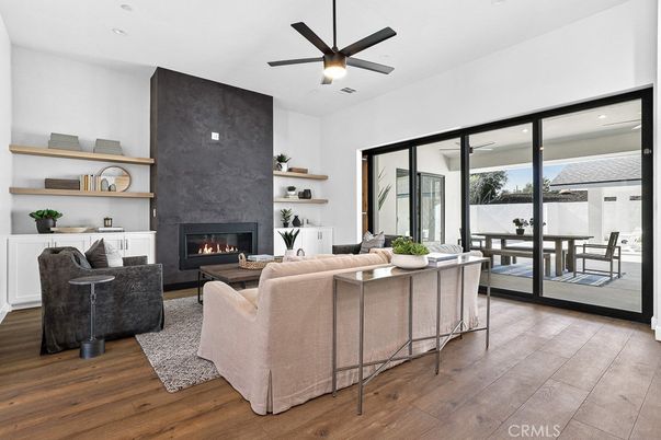 Dining room, Fireplace, Interior, Living room, Recessed Lighting, Wood Texture Flooring