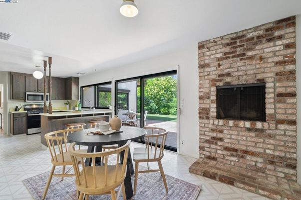 Dining room, Fireplace, Interior, Kitchen, Pendant Lights, Stainless Steel Appliances, Stone Walls