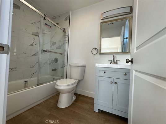 Bathroom, Glass Shower, Interior, Marble Walls, Wood Texture Flooring