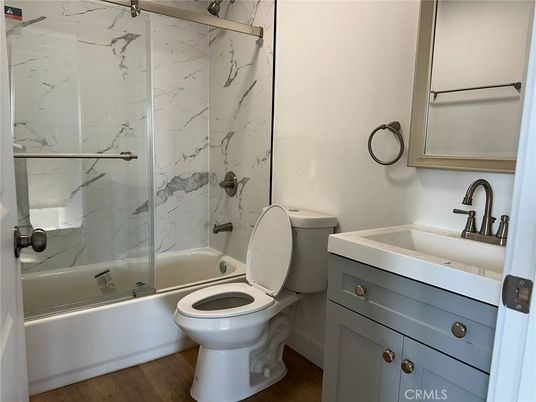 Bathroom, Glass Shower, Interior, Marble Walls, Wood Texture Flooring