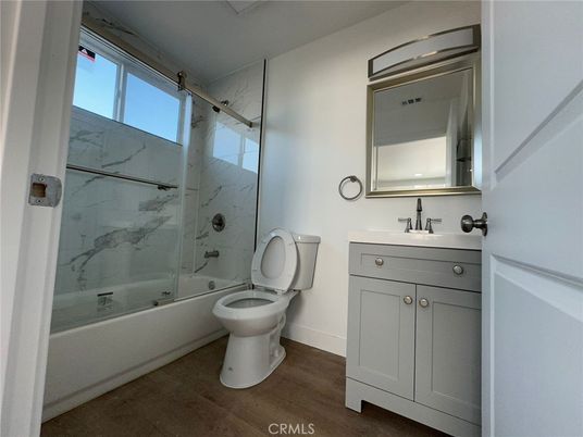 Bathroom, Glass Shower, Interior, Marble Walls, Wood Texture Flooring