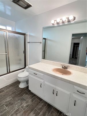 Bathroom, Dual Sink Vanities, Glass Shower, Interior, Tile Countertops, Wood Texture Flooring