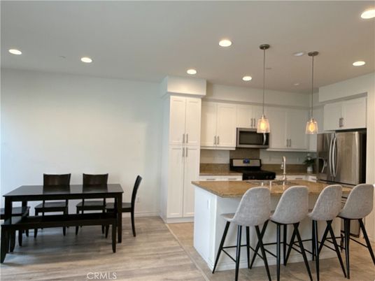 Dining room, Interior, Kitchen, Pendant Lights, Recessed Lighting, Stainless Steel Appliances, Wood Texture Flooring
