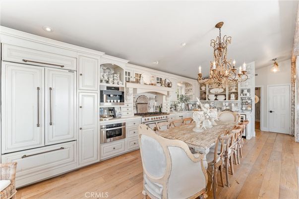 Chandelier, Dining room, Interior, Kitchen, Recessed Lighting, Stainless Steel Appliances, Wood Texture Flooring