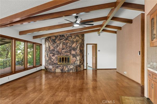 Empty room, Fireplace, Interior, Stone Walls, Wooden Beams, Wood Texture Flooring