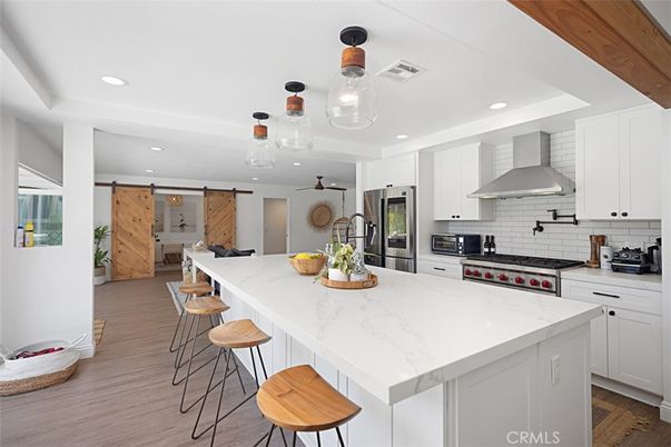 Dining room, Interior, Kitchen, Living room, Pendant Lights, Recessed Lighting, Stainless Steel Appliances, Wood Texture Flooring