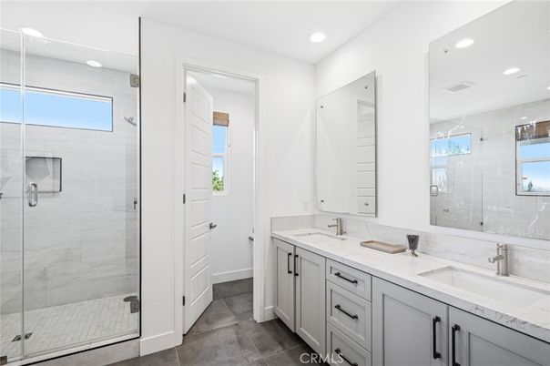 Bathroom, Dual Sink Vanities, Glass Shower, Interior, Marble Walls, Recessed Lighting