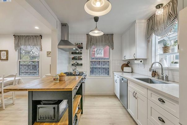 Dining room, Interior, Kitchen, Recessed Lighting, Stainless Steel Appliances, Wood Texture Flooring