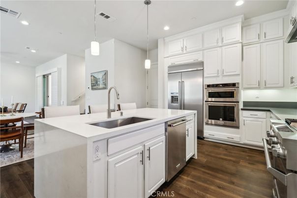 Dining room, Interior, Kitchen, Pendant Lights, Recessed Lighting, Stainless Steel Appliances, Wood Texture Flooring