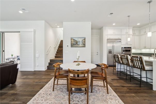 Dining room, Interior, Kitchen, Pendant Lights, Recessed Lighting, Stainless Steel Appliances, Wood Texture Flooring