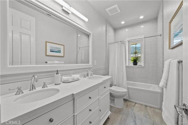 Bathroom, Dual Sink Vanities, Interior, Recessed Lighting, Wood Texture Flooring