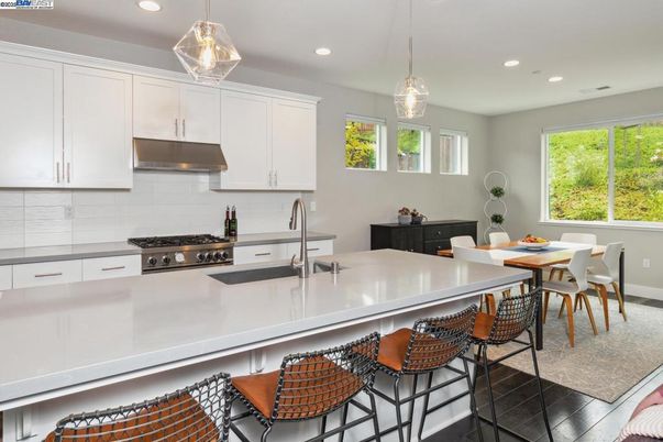 Dining room, Interior, Kitchen, Pendant Lights, Recessed Lighting, Stainless Steel Appliances, Wood Texture Flooring