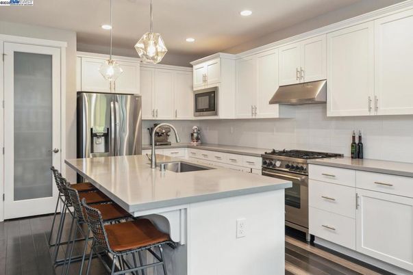 Interior, Kitchen, Pendant Lights, Recessed Lighting, Stainless Steel Appliances, Wood Texture Flooring