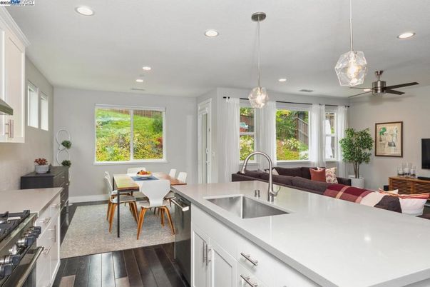 Dining room, Interior, Kitchen, Pendant Lights, Recessed Lighting, Stainless Steel Appliances, Wood Texture Flooring