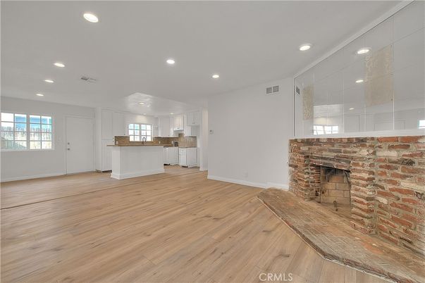 Empty room, Fireplace, Interior, Kitchen, Recessed Lighting, Wood Texture Flooring