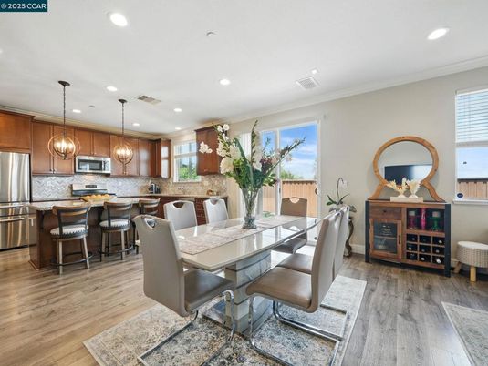 Dining room, Interior, Kitchen, Pendant Lights, Recessed Lighting, Stainless Steel Appliances, Wood Texture Flooring