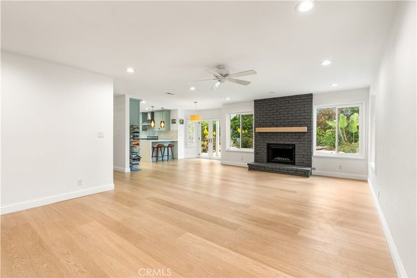 Empty room, Fireplace, Interior, Kitchen, Pendant Lights, Recessed Lighting, Wood Texture Flooring