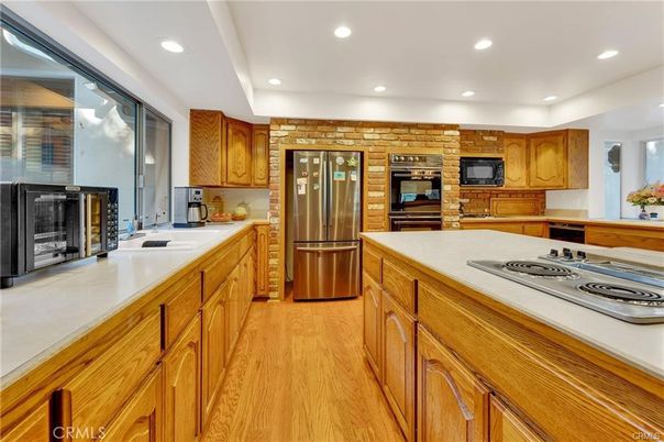 Interior, Kitchen, Recessed Lighting, Stainless Steel Appliances, Stone Walls, Wood Texture Flooring