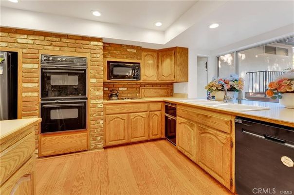 Interior, Kitchen, Recessed Lighting, Stainless Steel Appliances, Stone Walls, Wood Texture Flooring