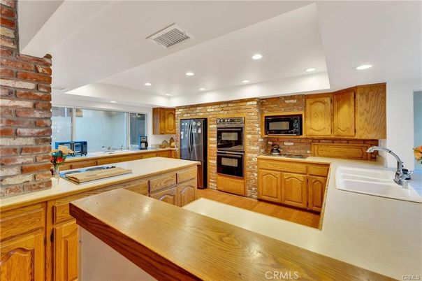 Interior, Kitchen, Recessed Lighting, Stainless Steel Appliances, Stone Walls, Wood Texture Flooring