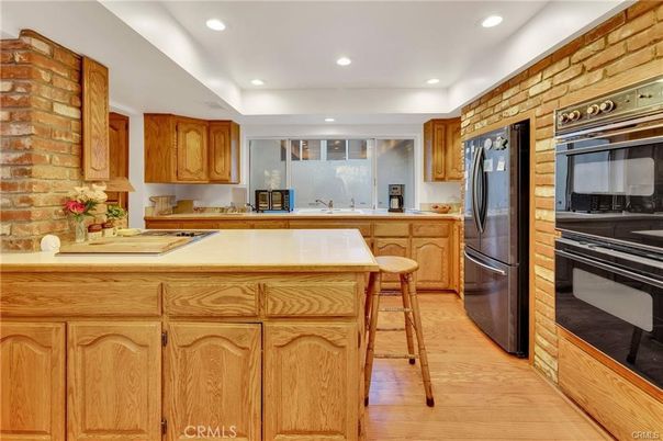 Interior, Kitchen, Recessed Lighting, Stainless Steel Appliances, Stone Walls, Wood Texture Flooring
