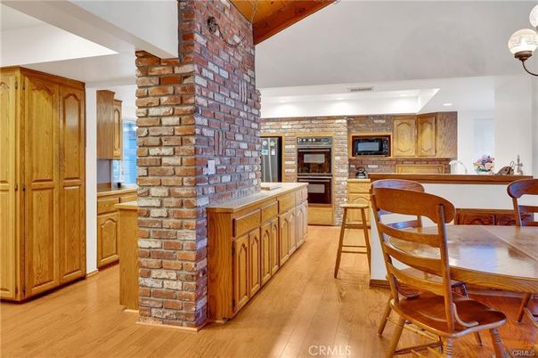 Dining room, Fireplace, Interior, Kitchen, Pendant Lights, Recessed Lighting, Stone Walls, Wood Texture Flooring