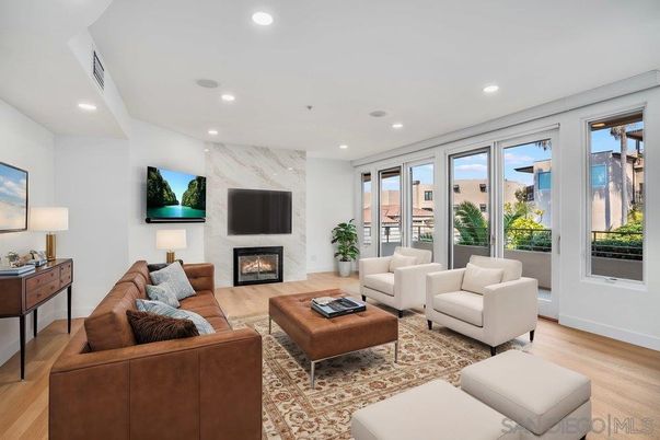 Fireplace, Interior, Living room, Marble Walls, Recessed Lighting, Wood Texture Flooring