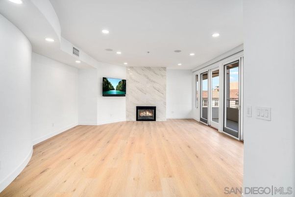 Empty room, Fireplace, Interior, Marble Walls, Recessed Lighting, Wood Texture Flooring