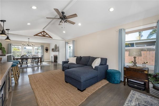 Chandelier, Dining room, Fireplace, Interior, Living room, Pendant Lights, Recessed Lighting, Wood Texture Flooring