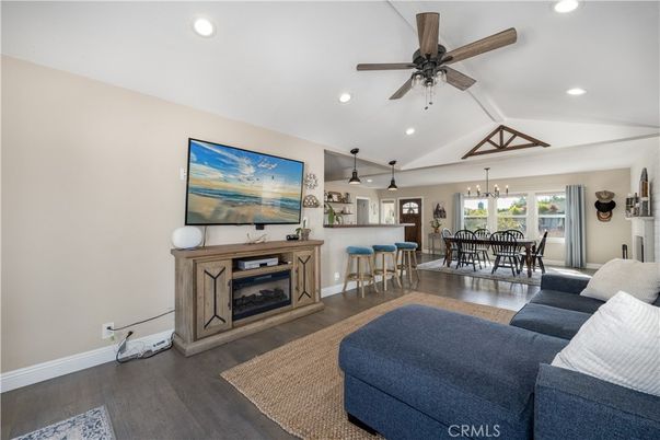Chandelier, Dining room, Fireplace, Interior, Living room, Pendant Lights, Recessed Lighting, Wood Texture Flooring