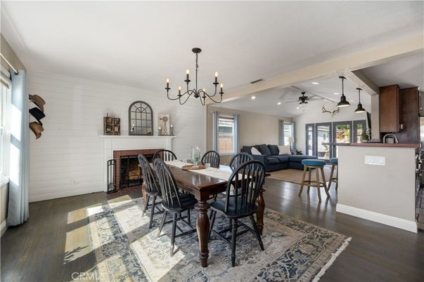 Chandelier, Dining room, Fireplace, Interior, Living room, Pendant Lights, Recessed Lighting, Wood Texture Flooring
