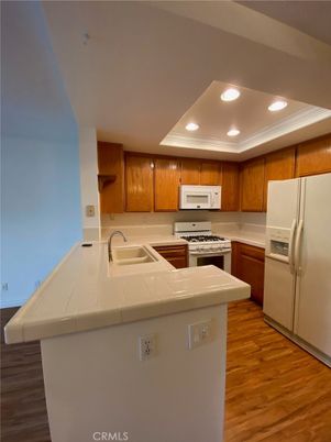 Interior, Kitchen, Recessed Lighting, Tile Countertops, Wood Texture Flooring