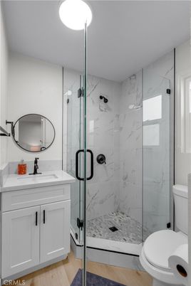 Bathroom, Glass Shower, Interior, Marble Walls, Wood Texture Flooring