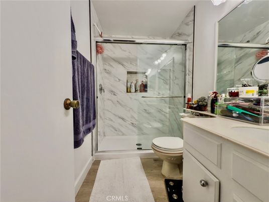 Bathroom, Glass Shower, Interior, Marble Walls, Wood Texture Flooring