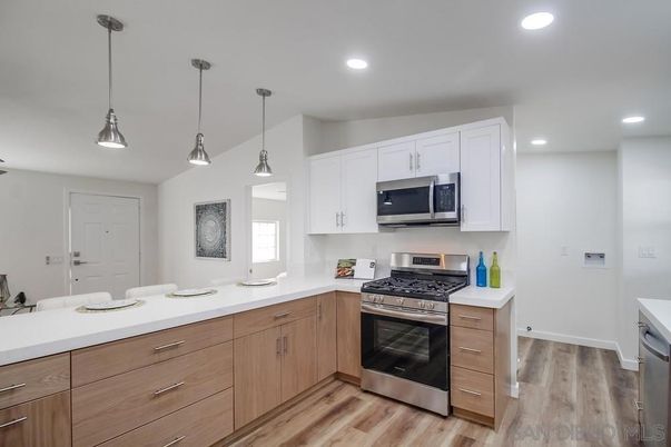 Interior, Kitchen, Pendant Lights, Recessed Lighting, Stainless Steel Appliances, Wood Texture Flooring