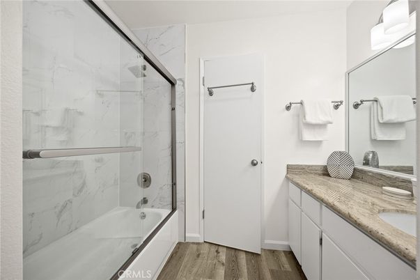 Bathroom, Glass Shower, Interior, Marble Walls, Wood Texture Flooring