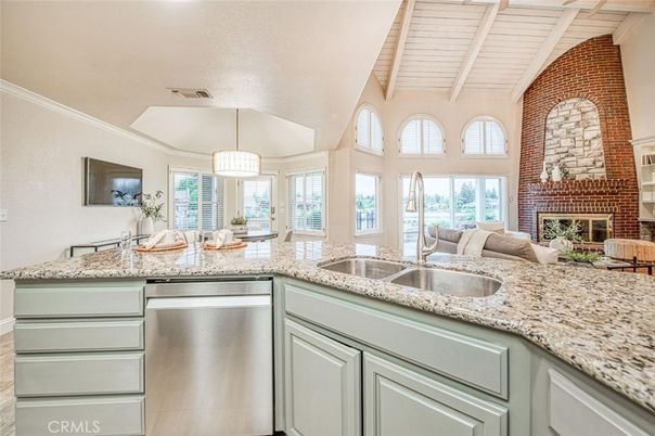 Fireplace, Interior, Kitchen, Pendant Lights, Stainless Steel Appliances, Stone Walls