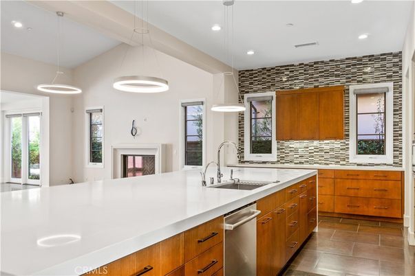 Fireplace, Interior, Kitchen, Pendant Lights, Recessed Lighting, Stainless Steel Appliances, Stone Walls
